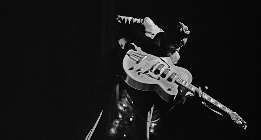 T-Bone Walker points the headstock of his Gibson ES-5 to the crowd during a '60s performance in Harlem, NYC.
