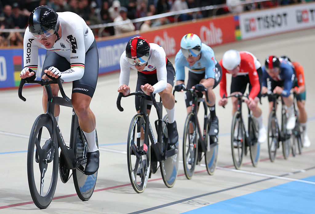 Germany's Moritz Augenstein (L) competes to win the men's scratch 10km final event of the 2025 UCI Track World Championships