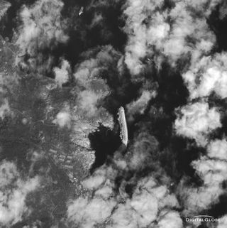 This photo, taken by a DigitalGlobe Earth-observing satellite, shows the cruise ship Costa Concordia as it appeared from space on Jan. 17, 2012. The luxury cruise ship ran aground in the Tuscan waters off of Giglio, Italy on Friday, January 13, 2012.