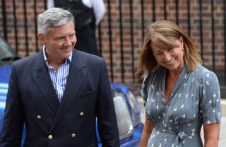 Carole Middleton and Michael Middleton arrive to see Catherine, Duchess of Cambridge and Prince William, Duke of Cambridge and their newborn son at the Lindo Wing at St Mary's Hospital on July 23, 2013 in London, England