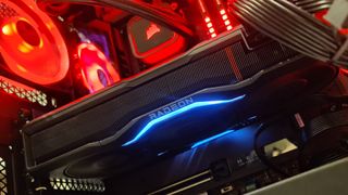 The RX 7900 XTX in a red-lit gaming PC