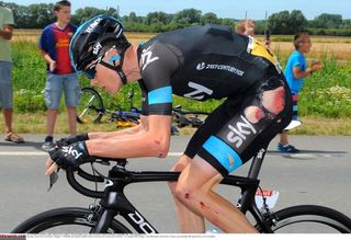 Chris Froome (Team Sky) chases back after a fall on stage four