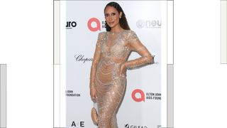 Elaine Welteroth wears a silver and crystal sheer dress as she attends Elton John AIDS Foundation's 31st annual academy awards viewing party on March 12, 2023 in West Hollywood, California.
