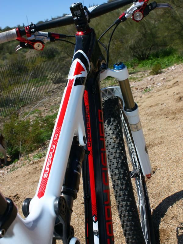 Hard points for the rear shock and suspension link are molded directly into the carbon fiber structure