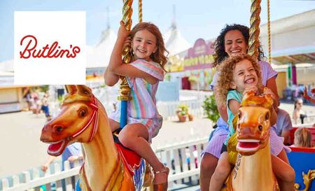Butlins logo placed over an image of a family of girls on a merry go round