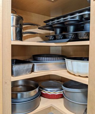 oven dishes in a cabinet
