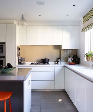 kitchen with white counter top and tiled flooring