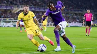 Christian Kouame of ACF Fiorentina and Milan Skriniar of FC Internazionale compete for the ball 