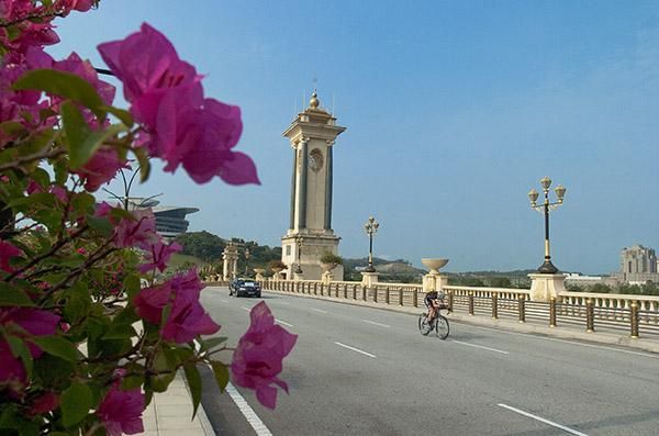 A rider heads over a bridge in the early stages of the 20 kilometre opening stage individual time trial