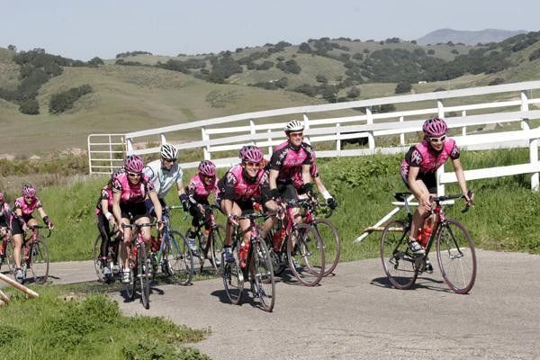 The riders go over a cow guard