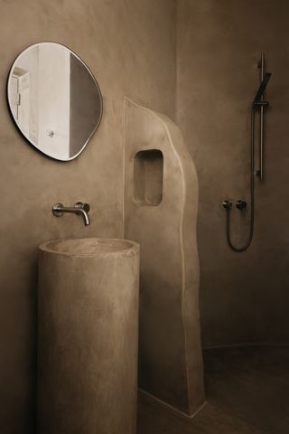 A small bathroom with micro cement walls