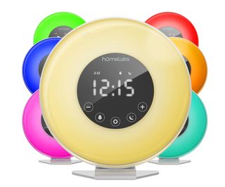 A hOmeLabs Sunrise Alarm Clock showing its various colors on a white background