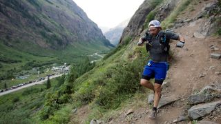 Christopher Agby #27 runs down the trail at the Hardrock 100 ultra distance run through the San Juan Mountains