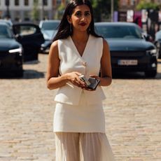 woman in white vest and skirt