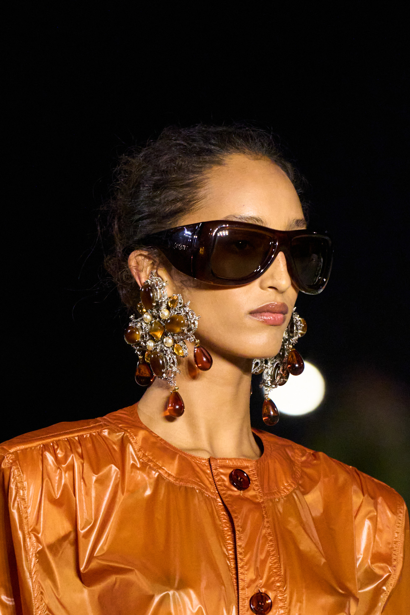 Photos of runway models wearing bug-eye sunglasses during the Spring Summer 2026 season.