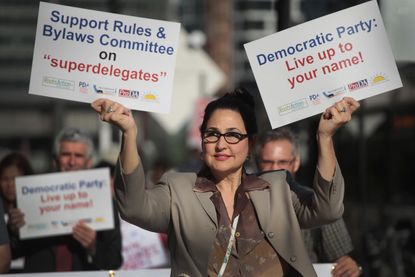 Demonstrators protesting the use of superdelegates by the Democratic Party.