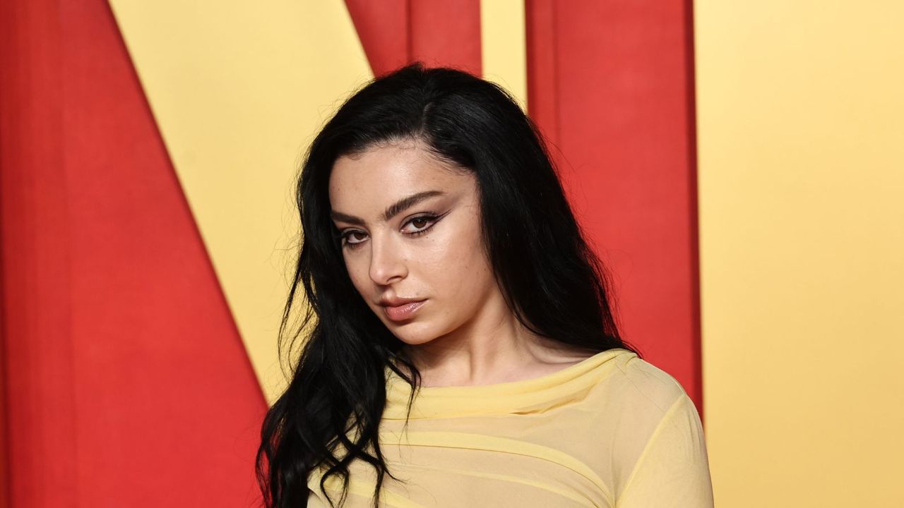 charli xcx on a red and yellow background for vanity fair