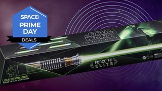 Star Wars: Black Series Luke Skywalker Force FX Elite Lightsaber on a purple background with a space.com Prime Day deals badge