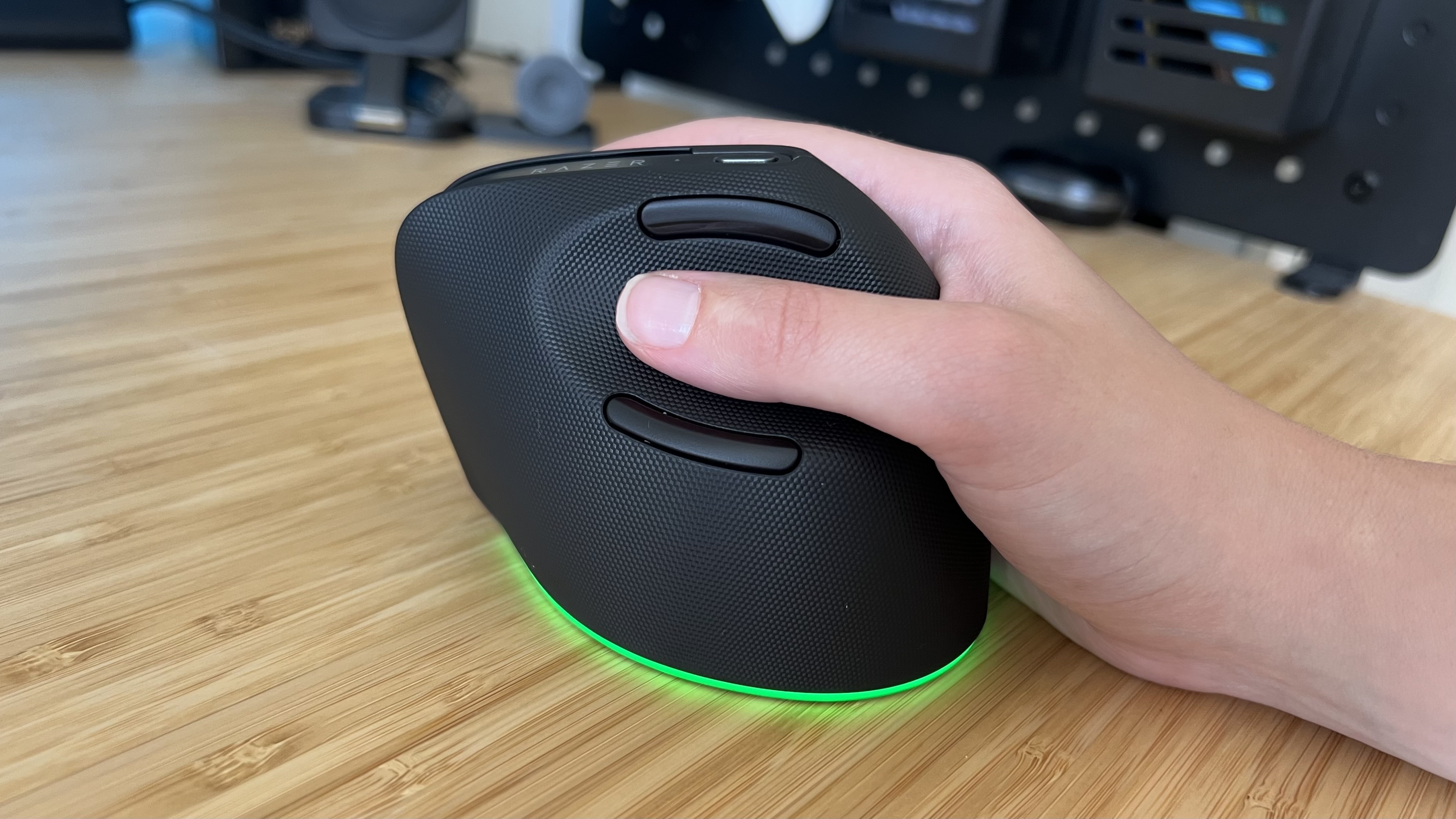 Hand using the Razer Pro Click V2 Vertical Edition gaming mouse