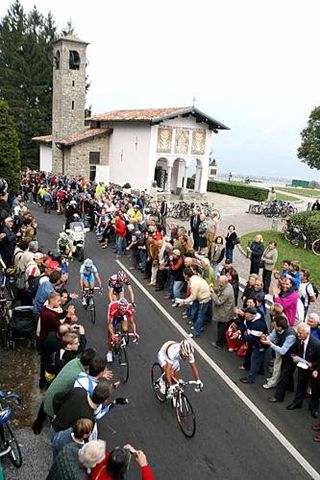 Riders pass Madonna del Ghisallo in Giro di Lombardia