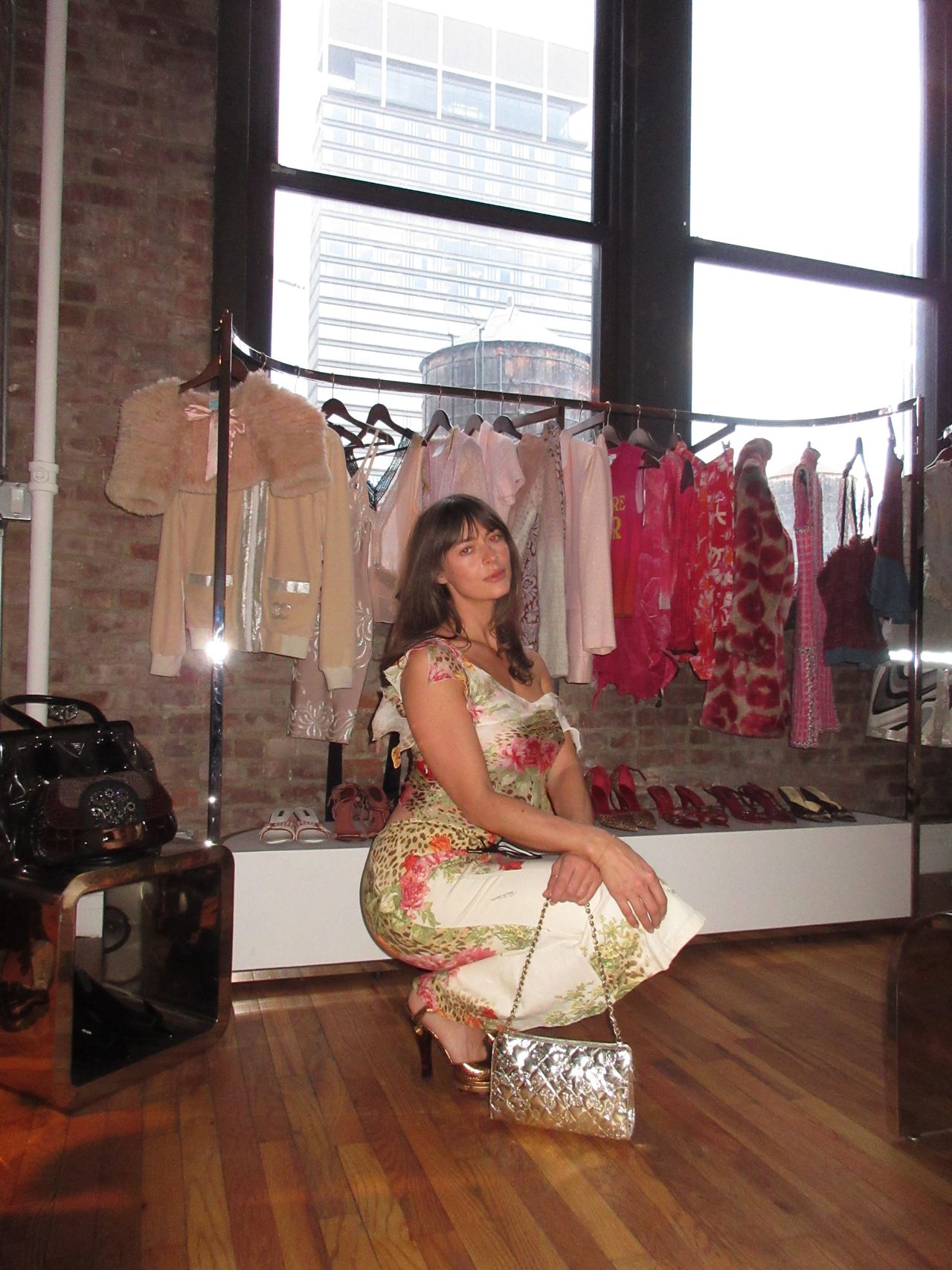 Kathryn zahorak wearing floral leopard print top and skirt with silver bag
