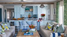 An open plan kitchen painted in Ocean Aire 2123-50 by Benjamin Moore