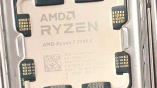 A closeup of an AMD Ryzen 7 7700X chip