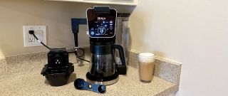 Ninja dualbrew pro coffee maker set up on kitchen countertop