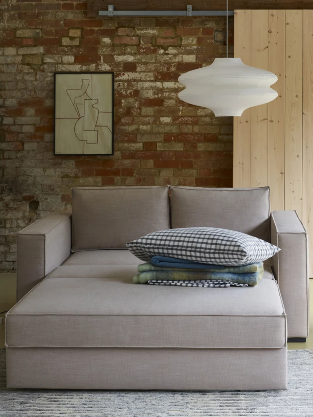 A gray sofa bed from Heal's