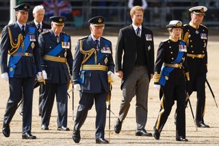 King Charles III, Princess Anne, Princess Royal and Prince Harry, Duke of Sussex follow the coffin of Queen Elizabeth II, pulled by a Gun Carriage of The King's Troop Royal Horse Artillery, during a procession from Buckingham Palace to Westminster Hall on September 14, 2022 in London, United Kingdom. Queen Elizabeth II's coffin is taken in procession on a Gun Carriage of The King's Troop Royal Horse Artillery from Buckingham Palace to Westminster Hall where she will lay in state until the early morning of her funeral.