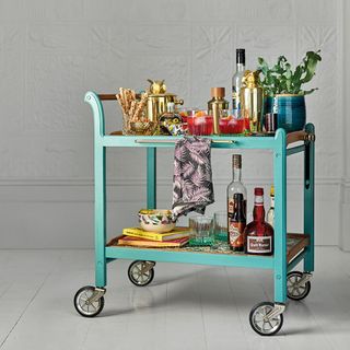 bar cart with wheels and bottles
