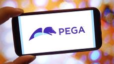 Pegasystems (Pega) logo and branding pictured on a smartphone screen held in person's hand.