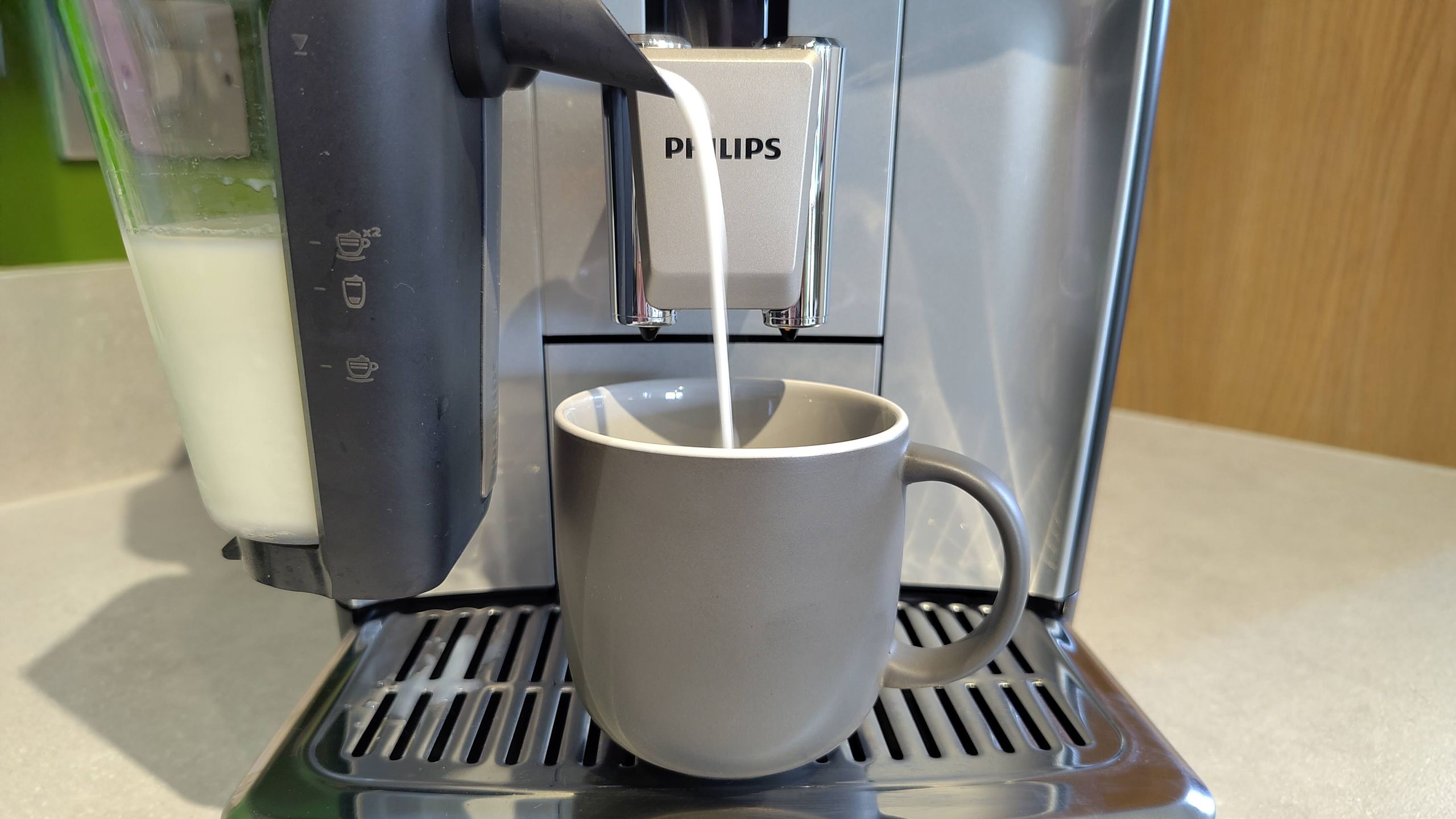 Philips LatteGo 5500 Series dispensing milk into cup
