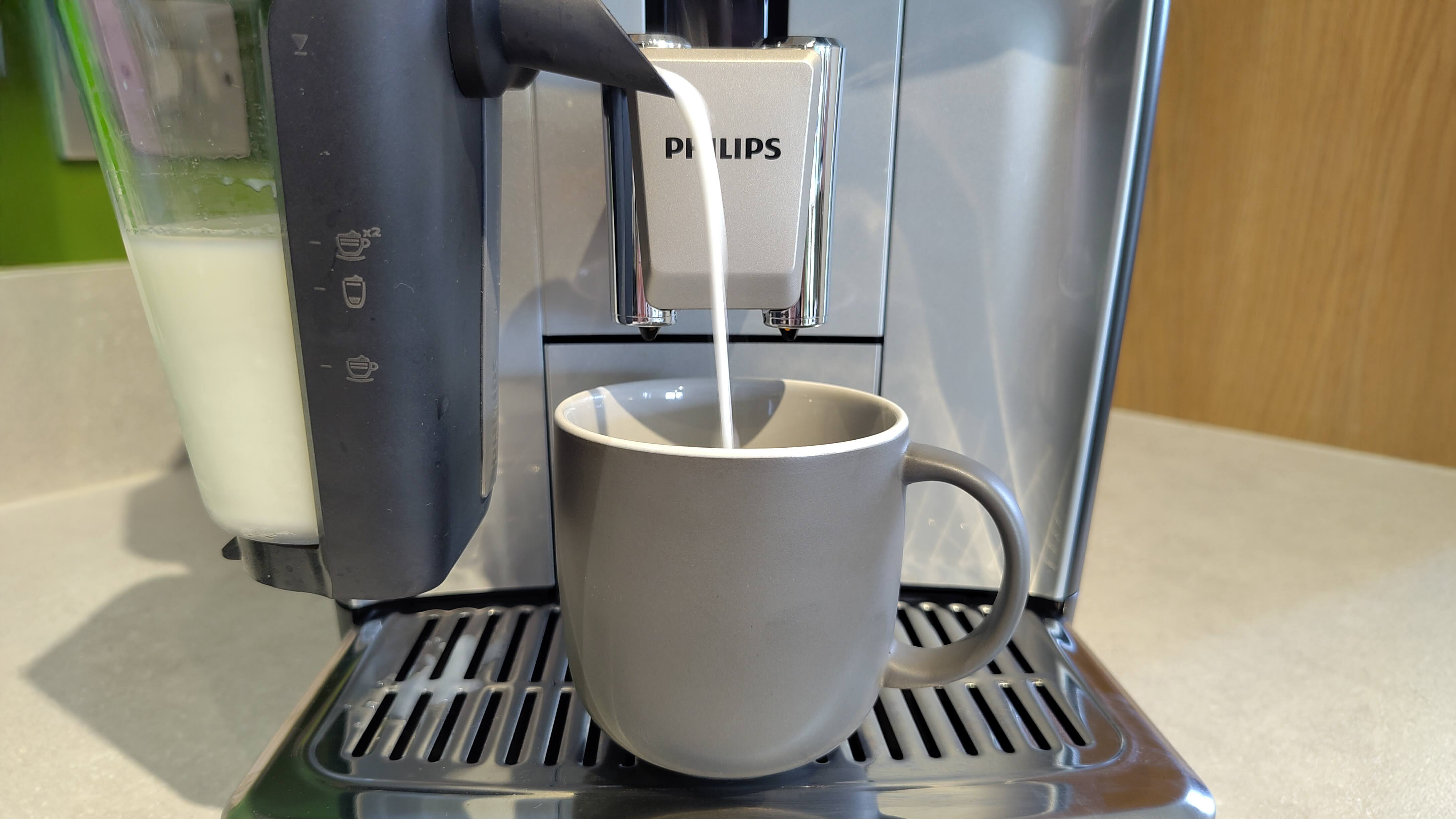 Milk dispensing from Philips LatteGo 5500 Series into cup