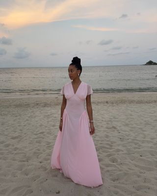 Influencer wearing a Rotate pink dress