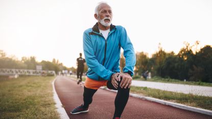 Cross training vs running: Image shows older man in running gear stretching