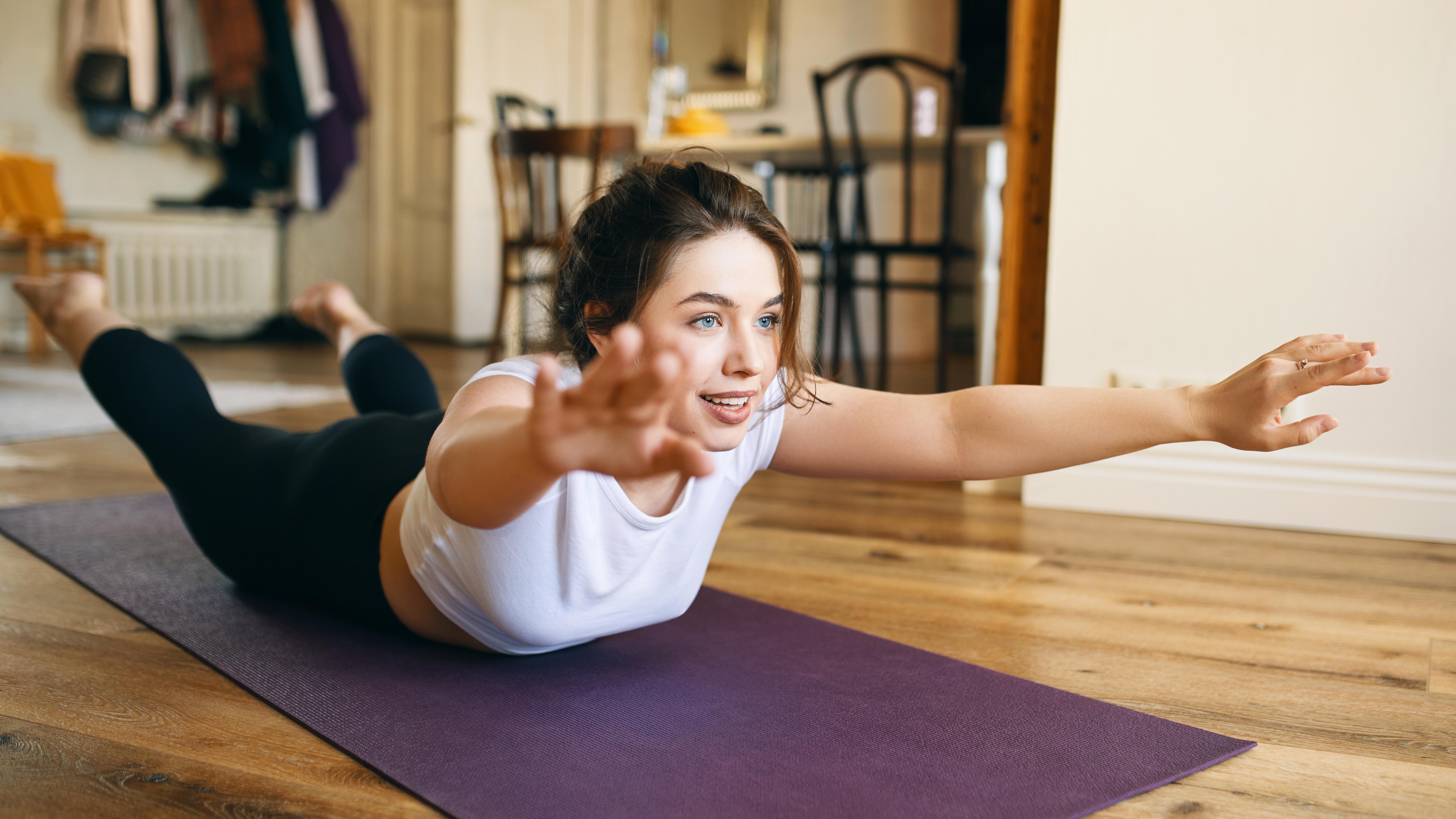 a woman lying on an exercise mat