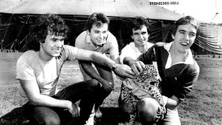 Cold Chisel holding a leopard cub backstage at a festival in 1982