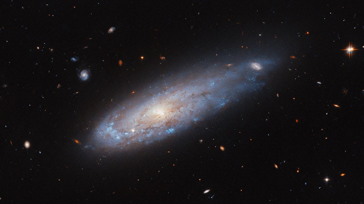 Space photo of the week: Hubble spies a ‘cannonball galaxy’ blasting through space