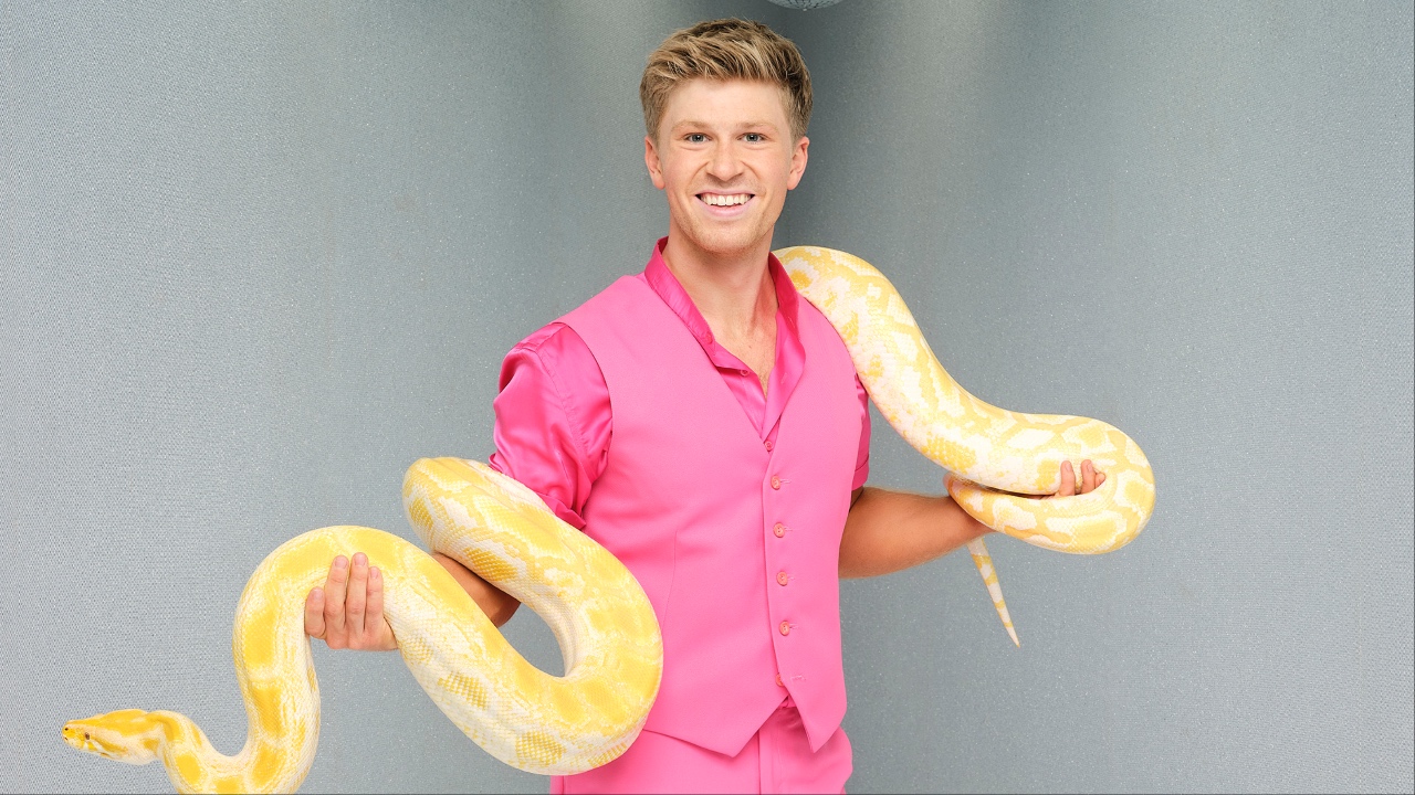 Robert Irwin posing with a snake for Dancing with the Stars Season 24