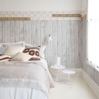 summer bedroom in scandinavian style with shaker theme and wood look wallpaper