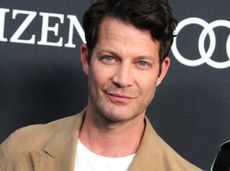 A headshot of Nate Berkus on a red carpet looking into the camera