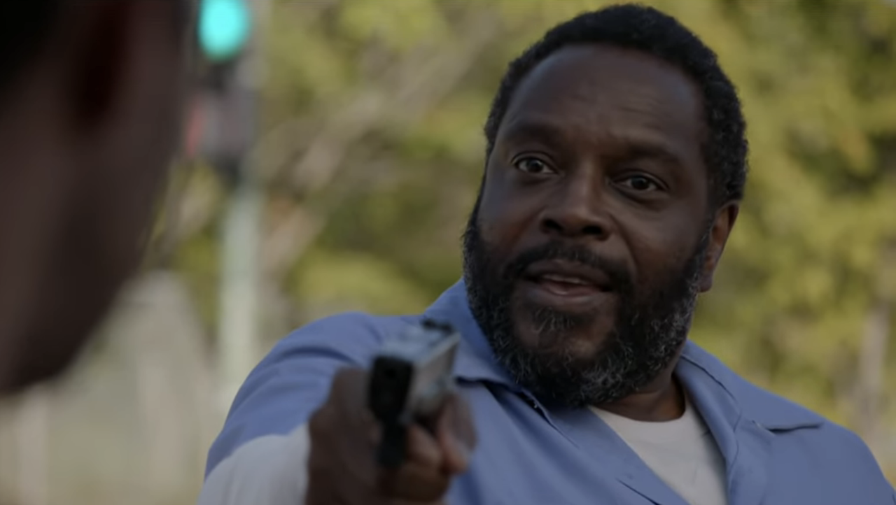 Chad L. Coleman as Morgan holding a gun on Torres in Chicago P.D. Season 13x06