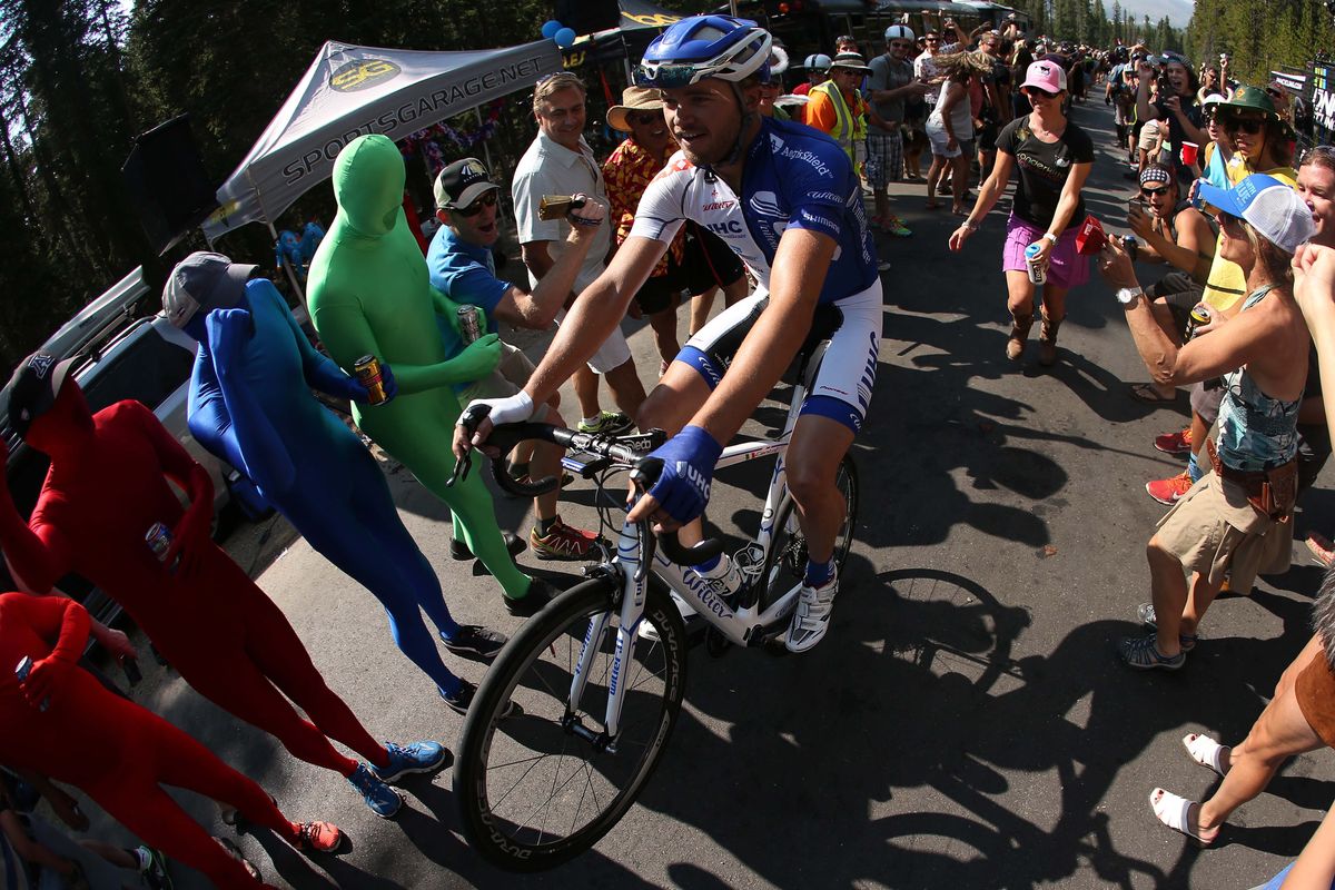 Daniel Summerhil of Unitedhealthcare does a wheelie through the crowds on Moonstone Pass