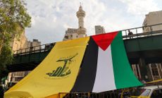 Palestinian flag alongside Hezbollah flag