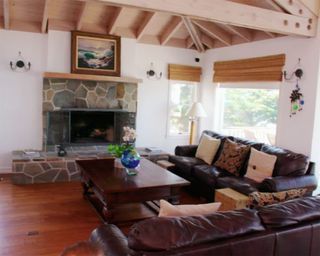 living room with larger seating area and wooden floor