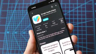 The new Google Health app shown on an iPhone 16 