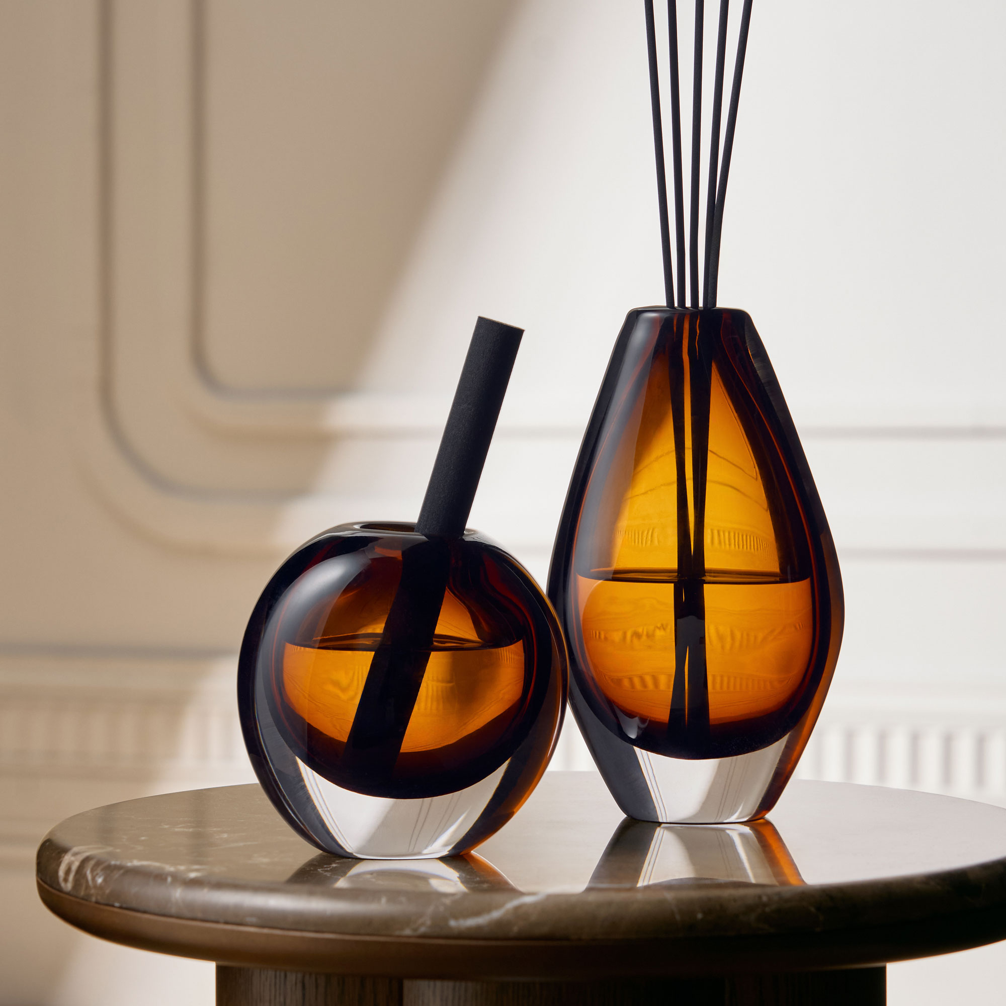Amber glass diffusers with black reeds