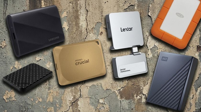 A collection of hard drives on a concrete background