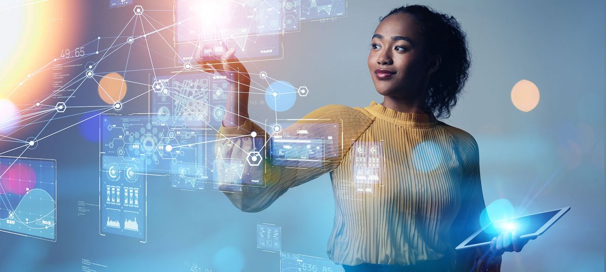 Black woman holding tablet lookng at technological projection